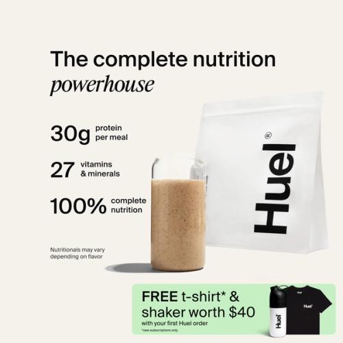 A bag of Huel powder next to a glass containing a Huel drink on a neutral background