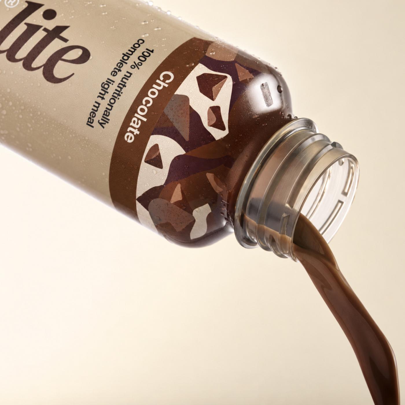 Huel chocolate pouring from a bottle of Huel Ready-to-drink lite on a beige background