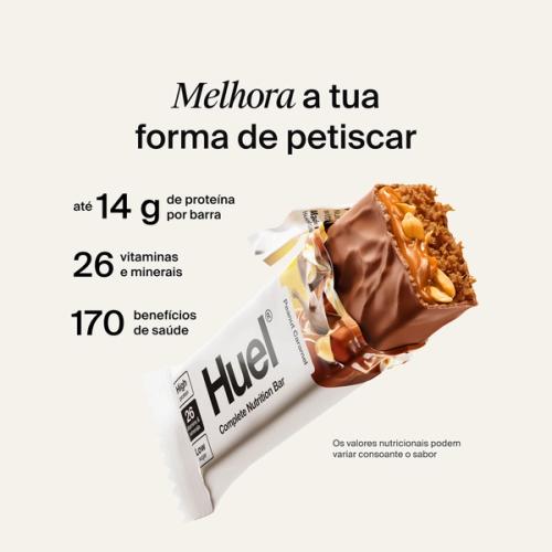 A Huel Complete Nutrition bar with a peanut and caramel filling, set against a beige-colour background
