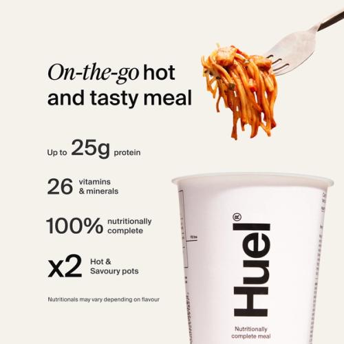 A fork with spicy noodles being pulled from a pot of Huel Hot & Savoury
