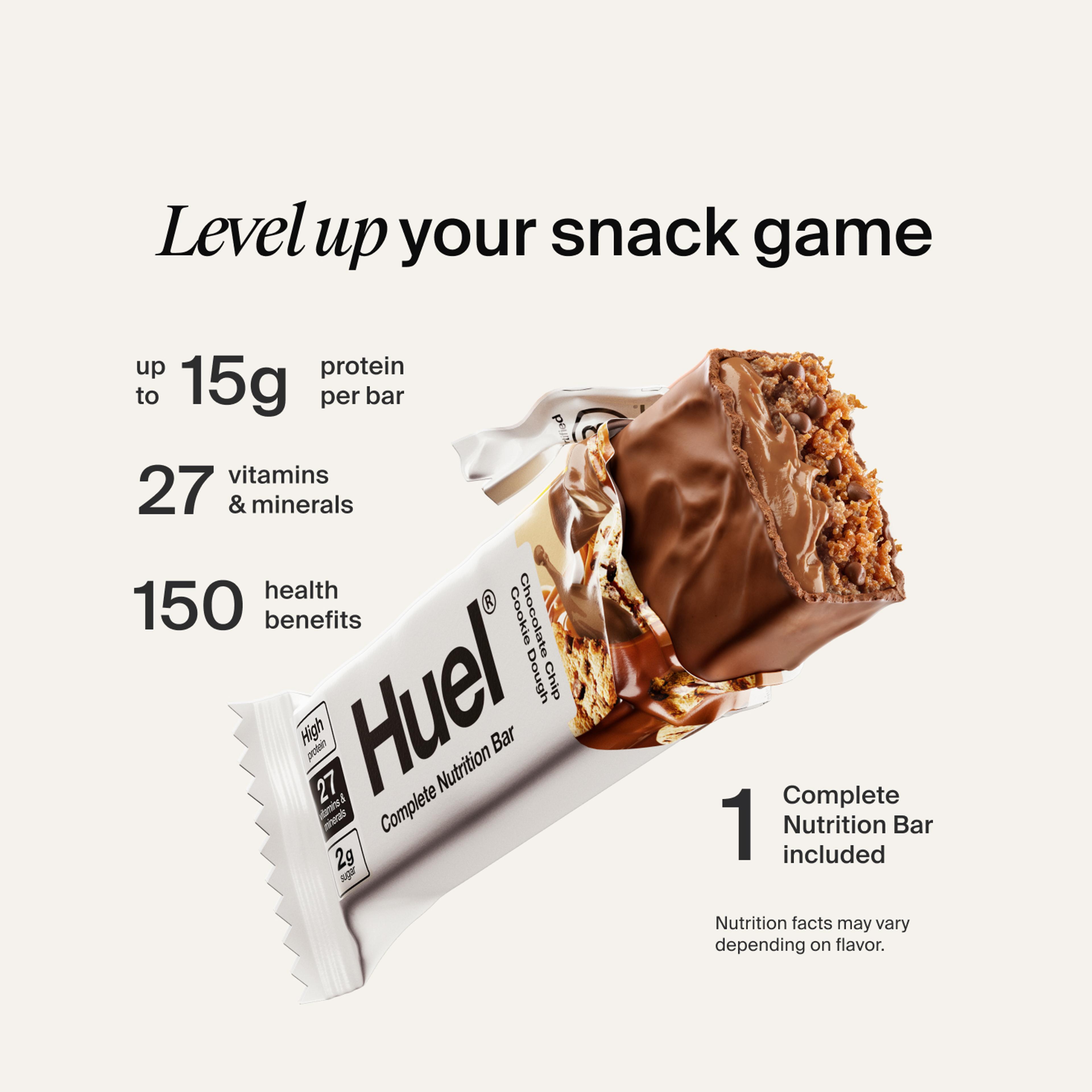 Huel Complete Protein bar with its wrapper ripped open on a neutral colour background