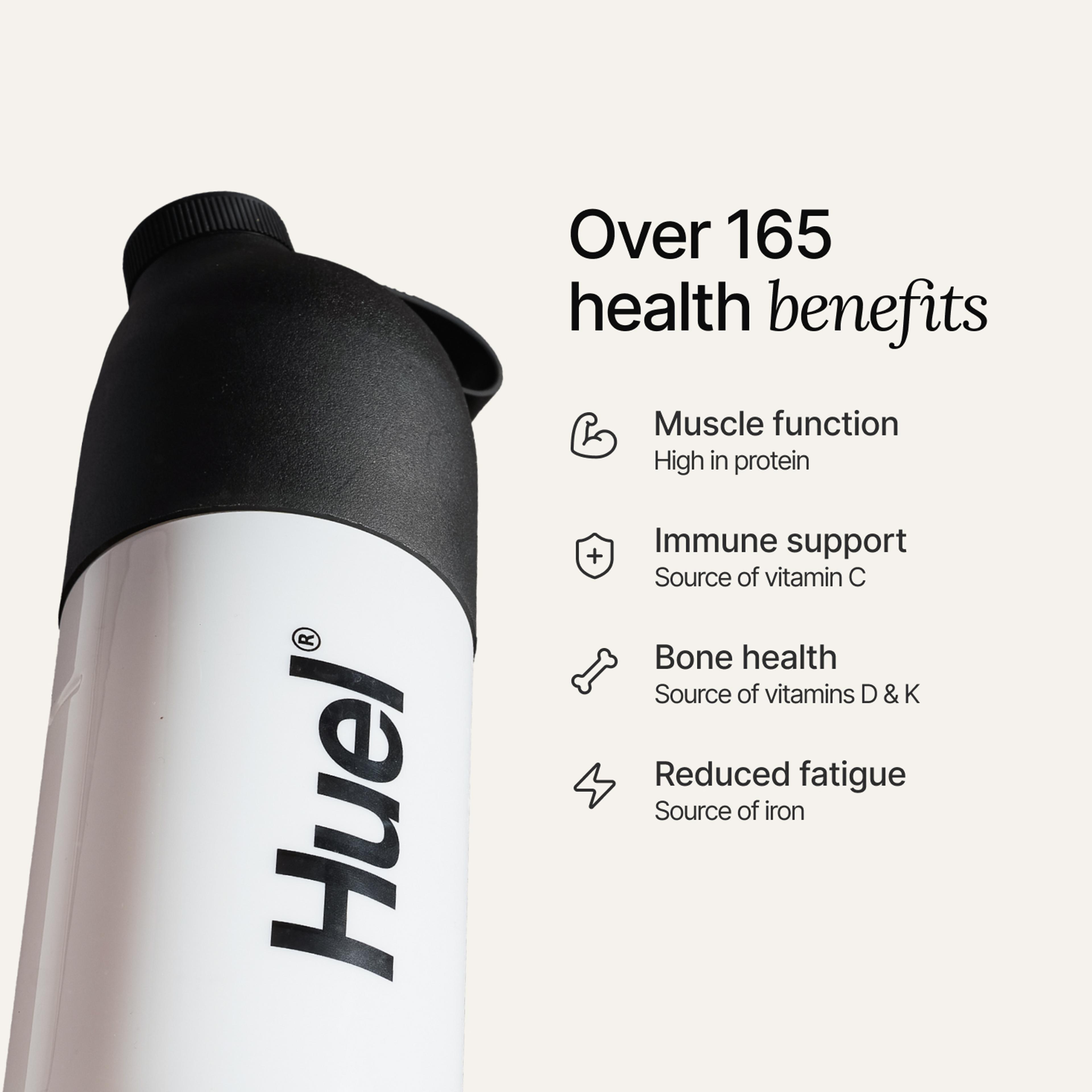A black and white Huel shaker on a neutral colour background with health benefits in text beside it