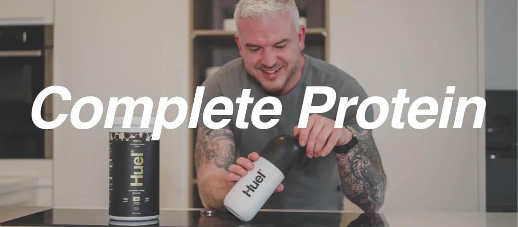 Man holding complete protein shaker