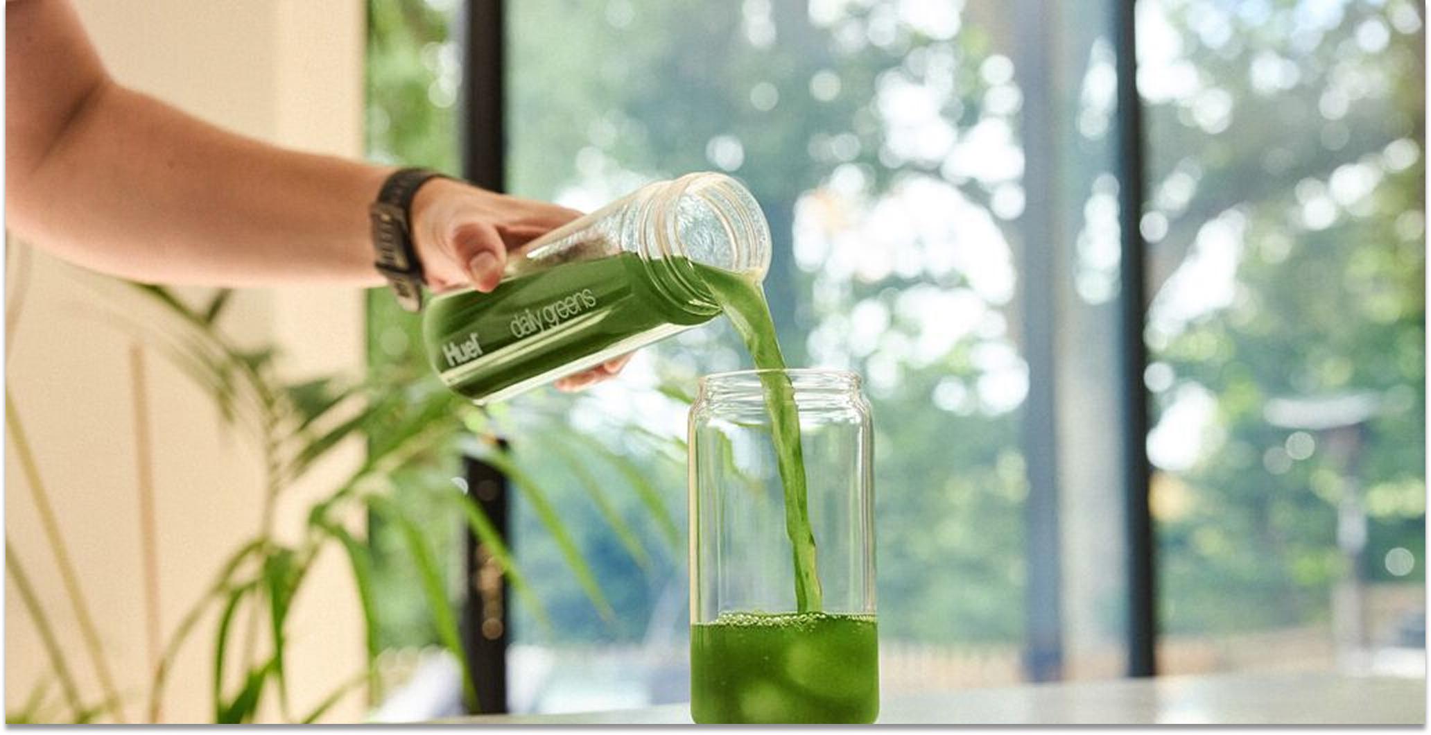 Image of Huel's factory in Milton Keynes with the Huel truck and employees standing in front of it