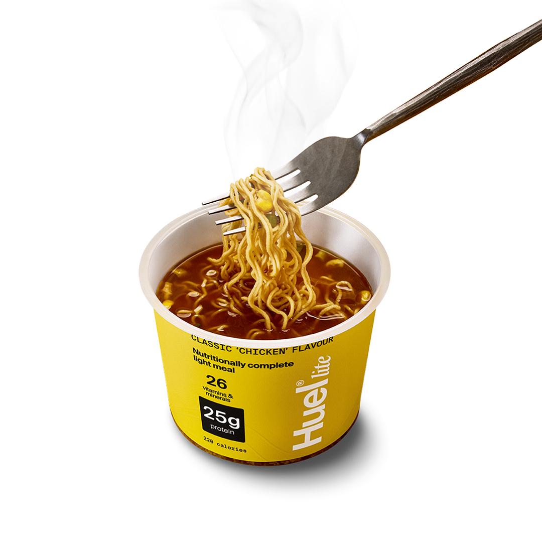 A fork pulling the noodles of the Huel Lite Ramen put out to show the contents