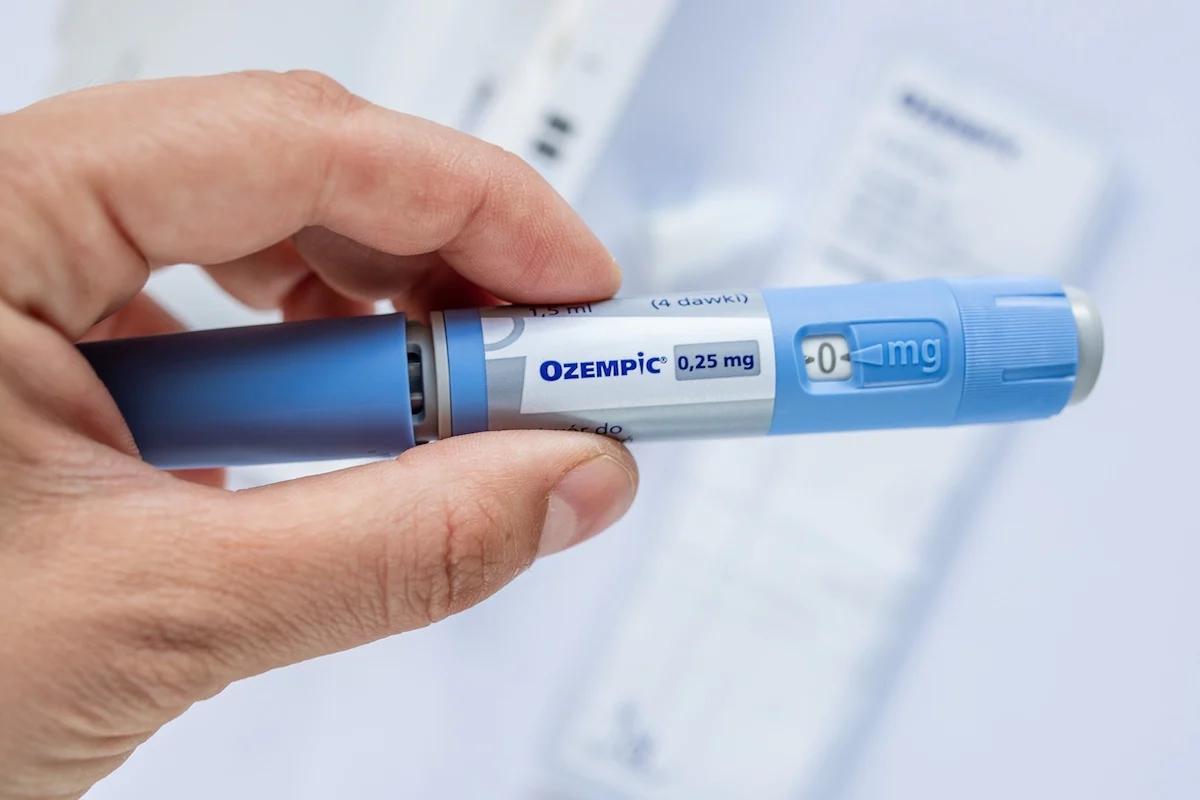 Someone holding an Ozempic injection pen
