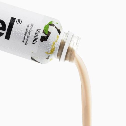 Huel Vanilla pouring from a bottle of Huel Ready-to-drink