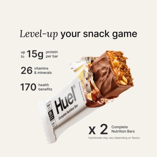 An image of a Huel Complete Nutrition protein bar in a ripped wrapper