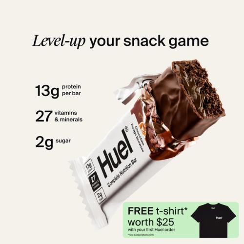 A houeal.complete Nutrition bar with a peanut and caramel filling, set against a beige-colour background