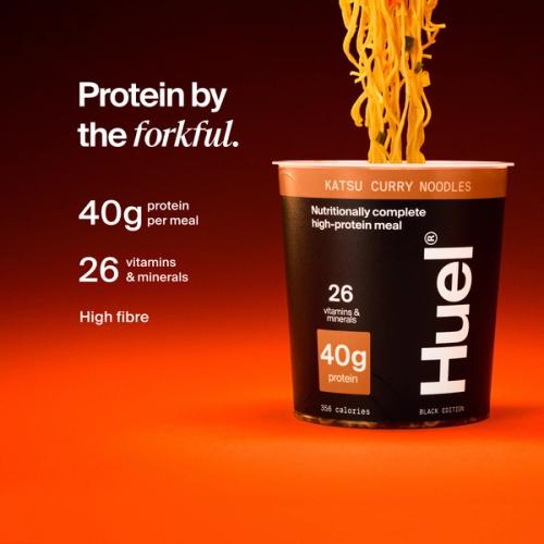 Huel Black Edition Katsu Curry Noodles pot with noodles being lifted, alongside text highlighting 40g protein, 26 vitamins and minerals, and high fibre.