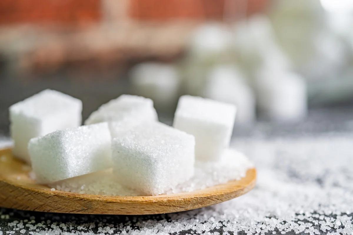 sugar cubes on a wooden spoon