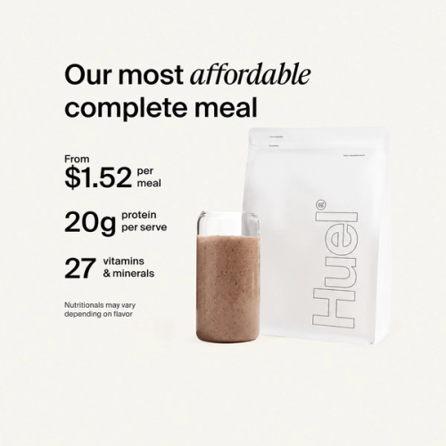 A white pouch of Huel Essential and a Huel shaker on a neutral colour background