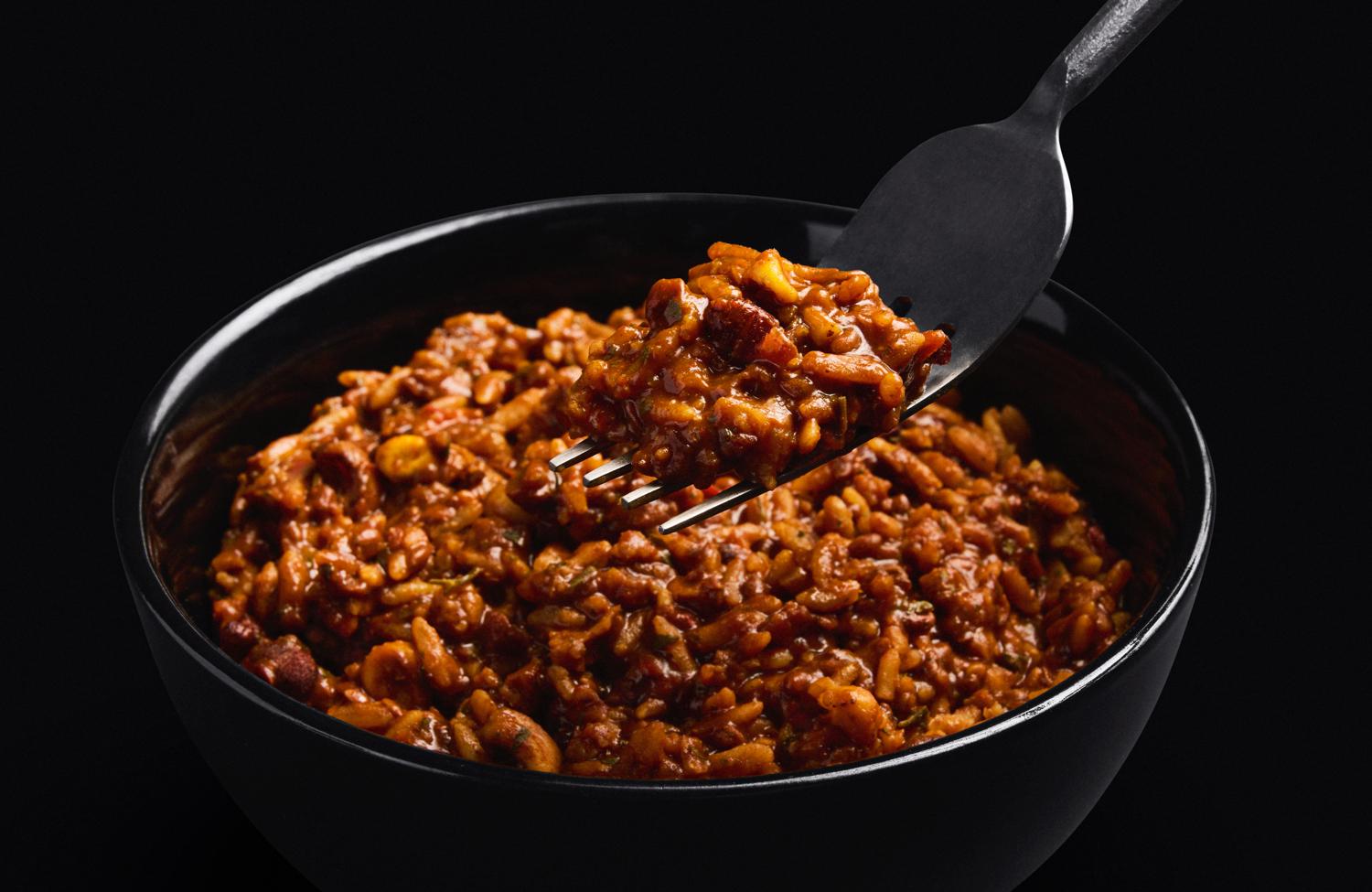 Close-up of H&S Mexican Chilli in a bowl set against a black background