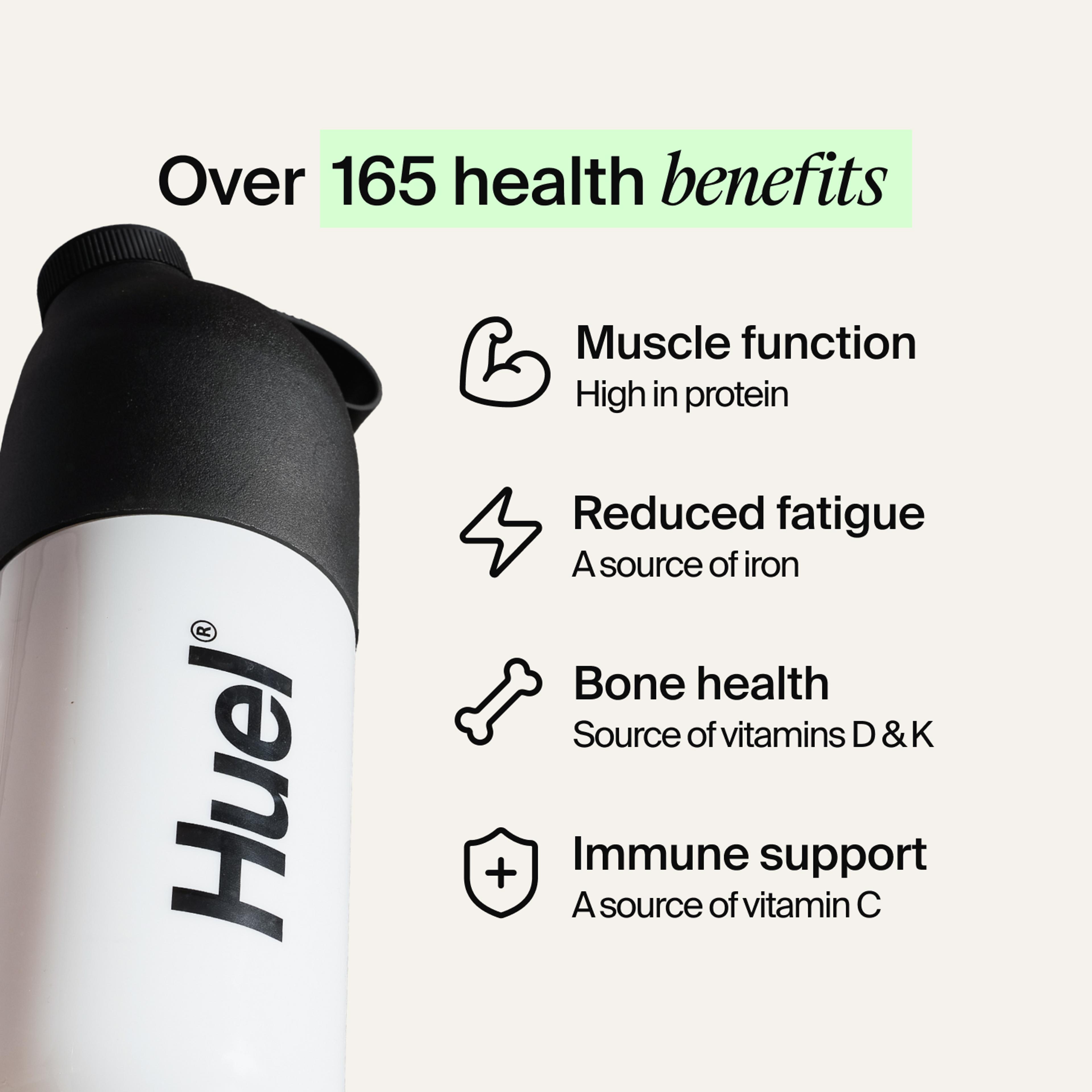 A black and white Huel shaker on a neutral colour background with health benefits in text beside it