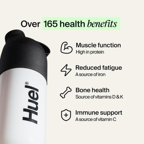 A black and white Huel shaker on a neutral colour background with health benefits in text beside it