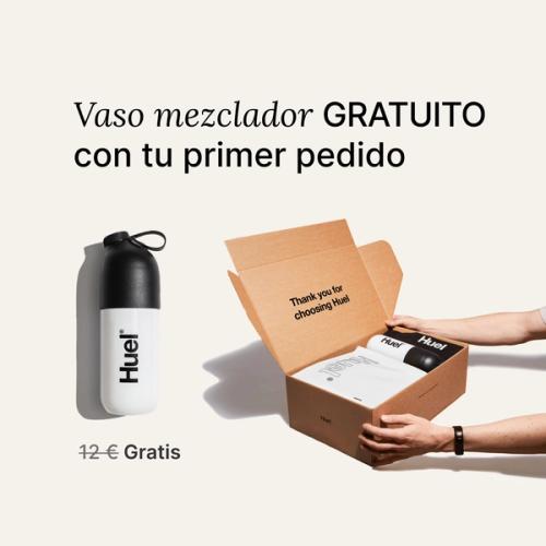 someone holding a Huel box containing a white powder bag, and a black and white shaker, on a neutral background