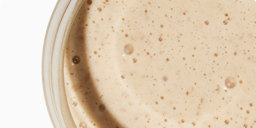 A close-up of Huel Powder in a glass