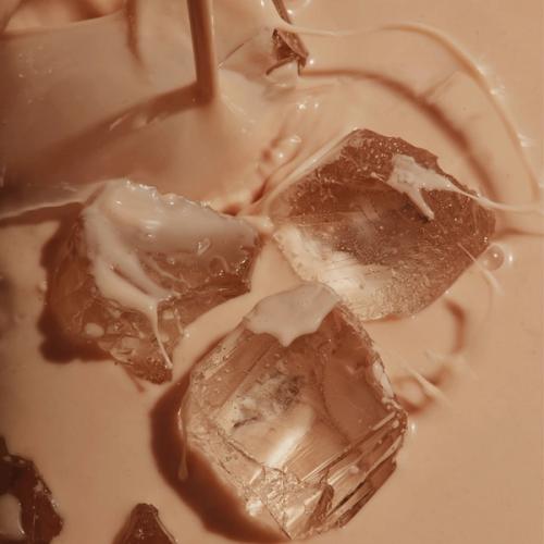 Huel Chocolate Black Edition RTD with ice cubes in a glass