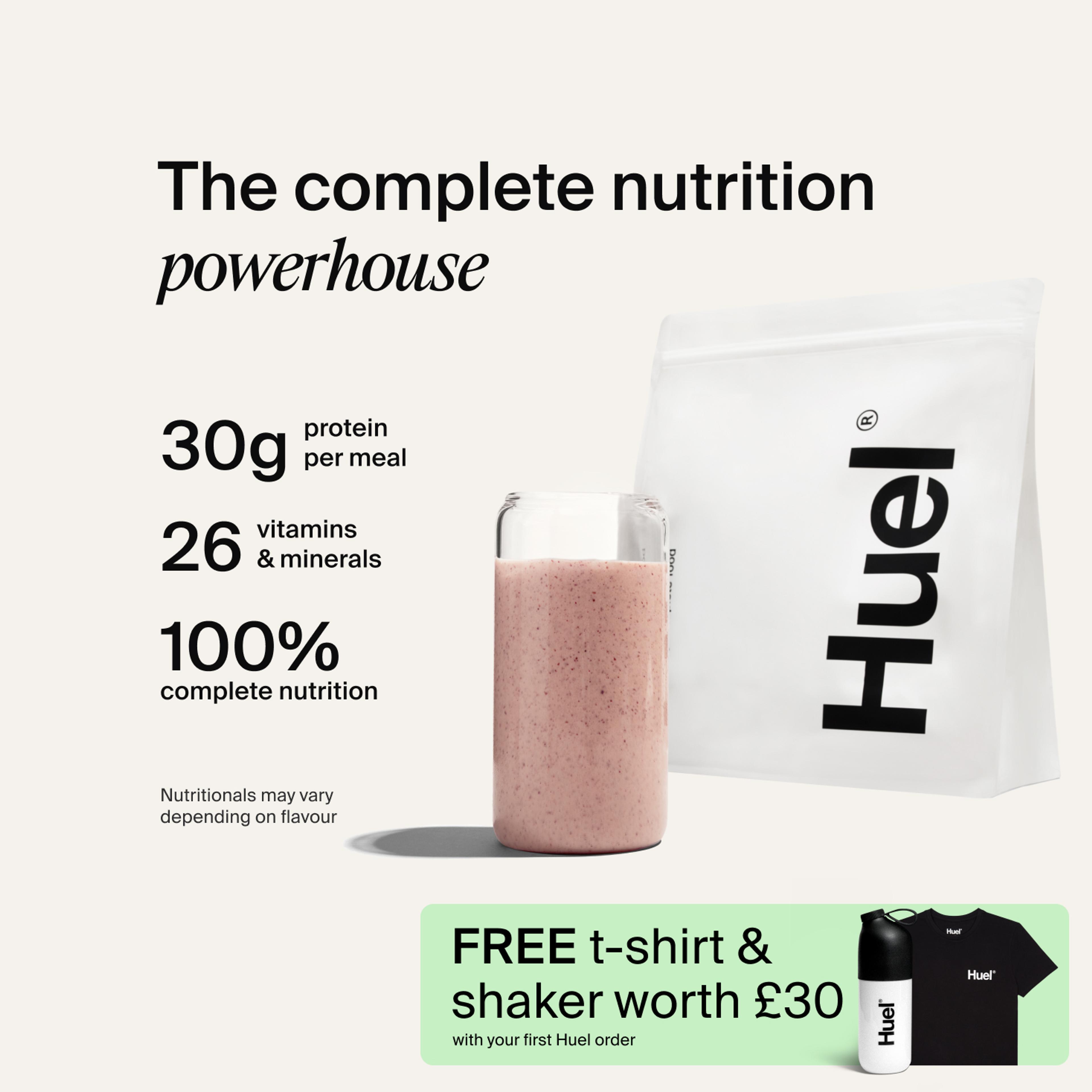 A bag of Huel powder next to a glass containing a Huel drink on a neutral background