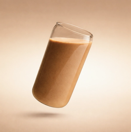 A glass of Huel Diet floating on a beige background