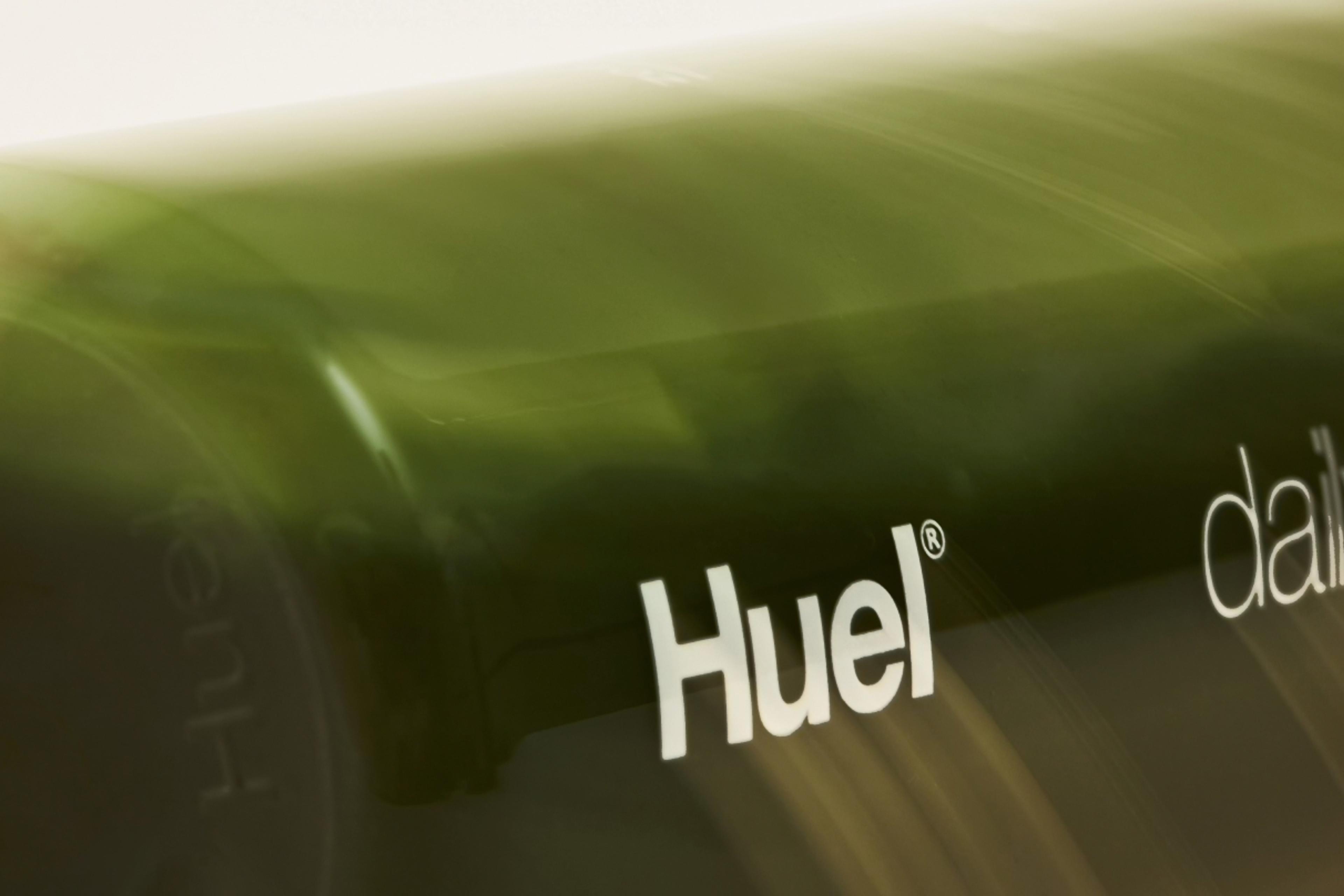 Huel Daily Greens Bottle rolling on its side