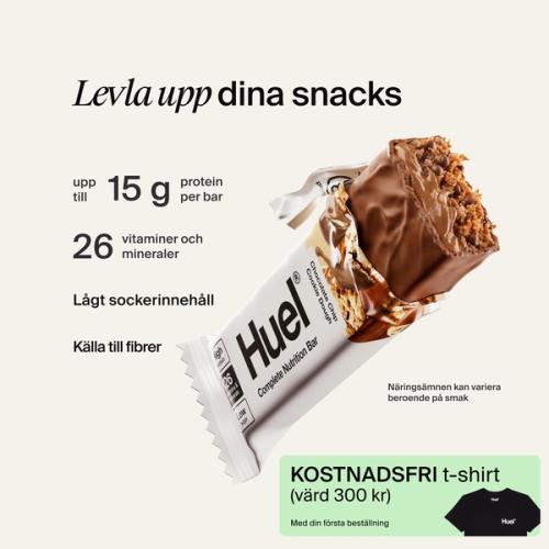 A Huel Complete Nutrition bar with a peanut and caramel filling, set against a beige-colour background