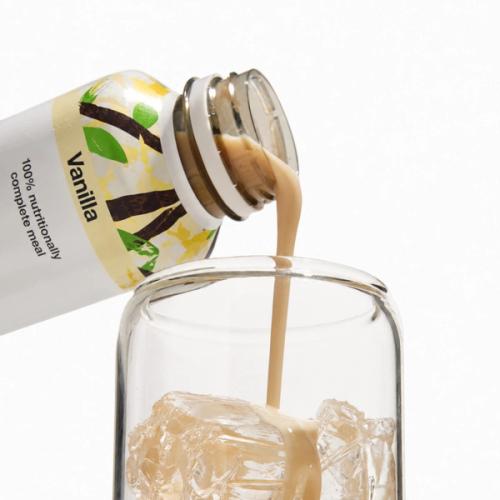 Vanilla Huel RTD being poured into a glass with ice