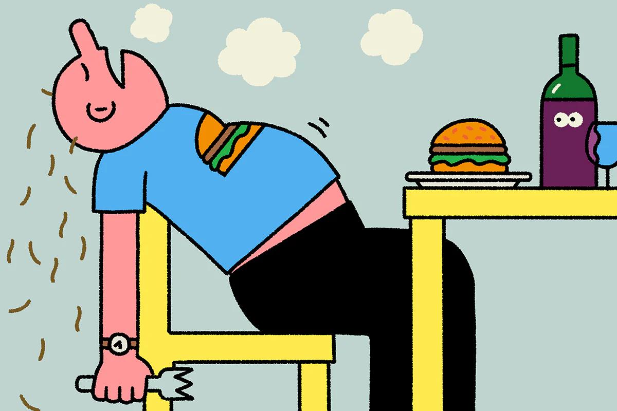 cartoon image of man sat asleep at the dining table with a burger and bottle of wine