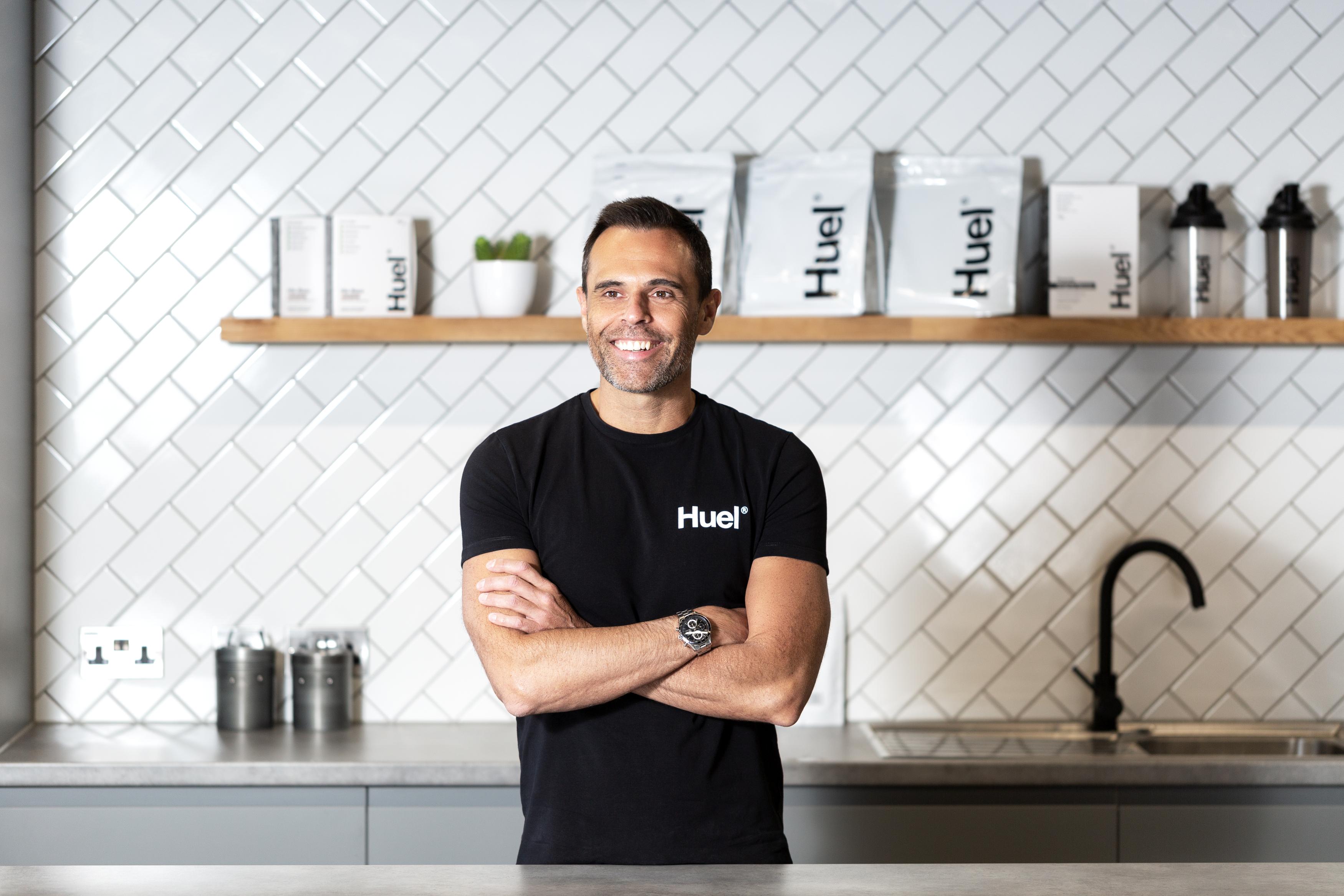 An image of Julian Hearn, the founder of Huel, with his arms crossed and smiling.