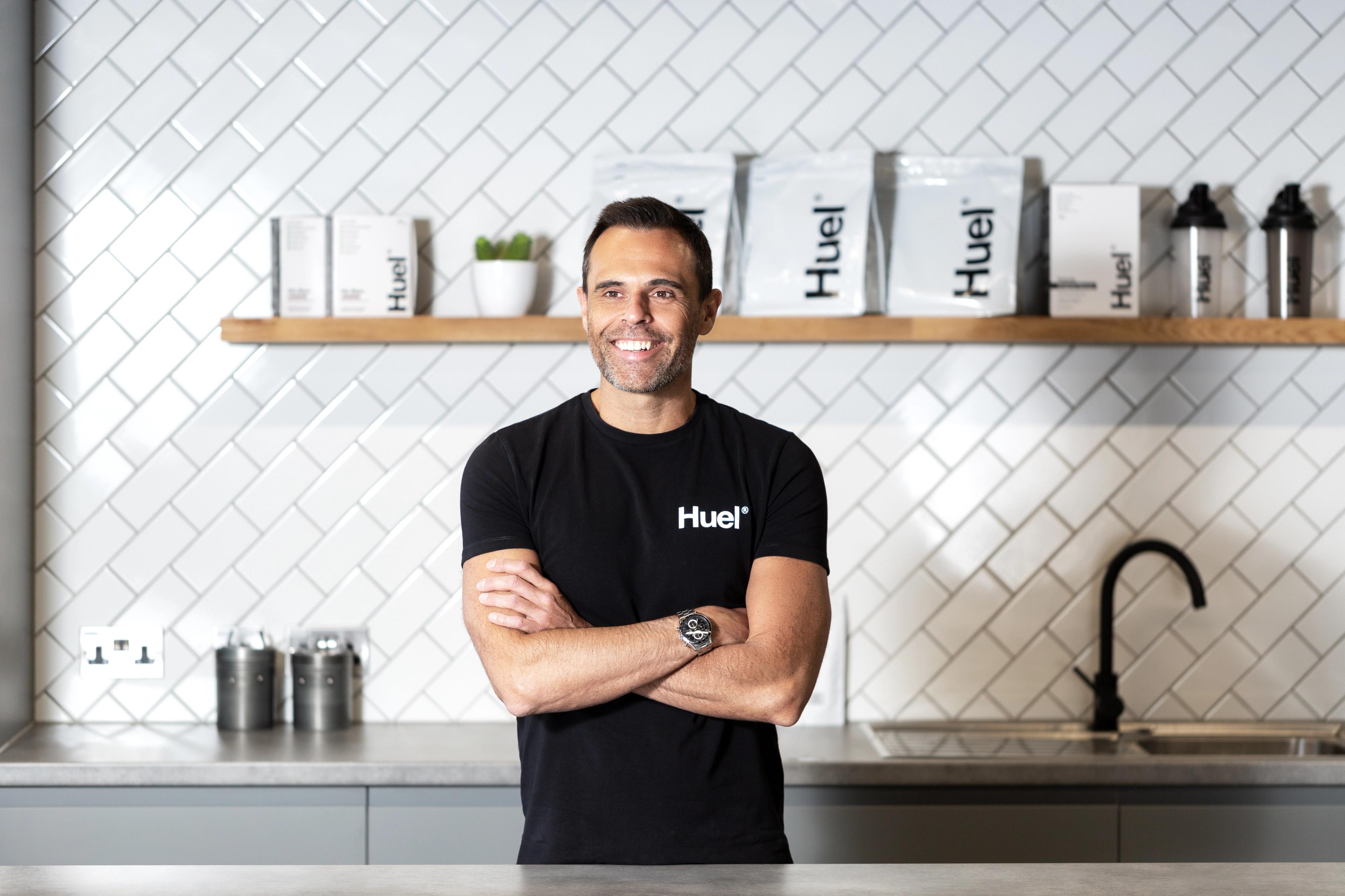 An image of Julian Hearn, the founder of Huel, with his arms crossed and smiling.