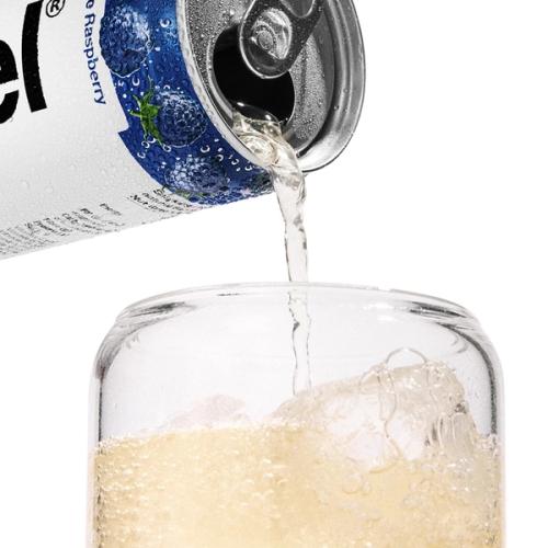 Pouring a cup of DAZ into a glass cup