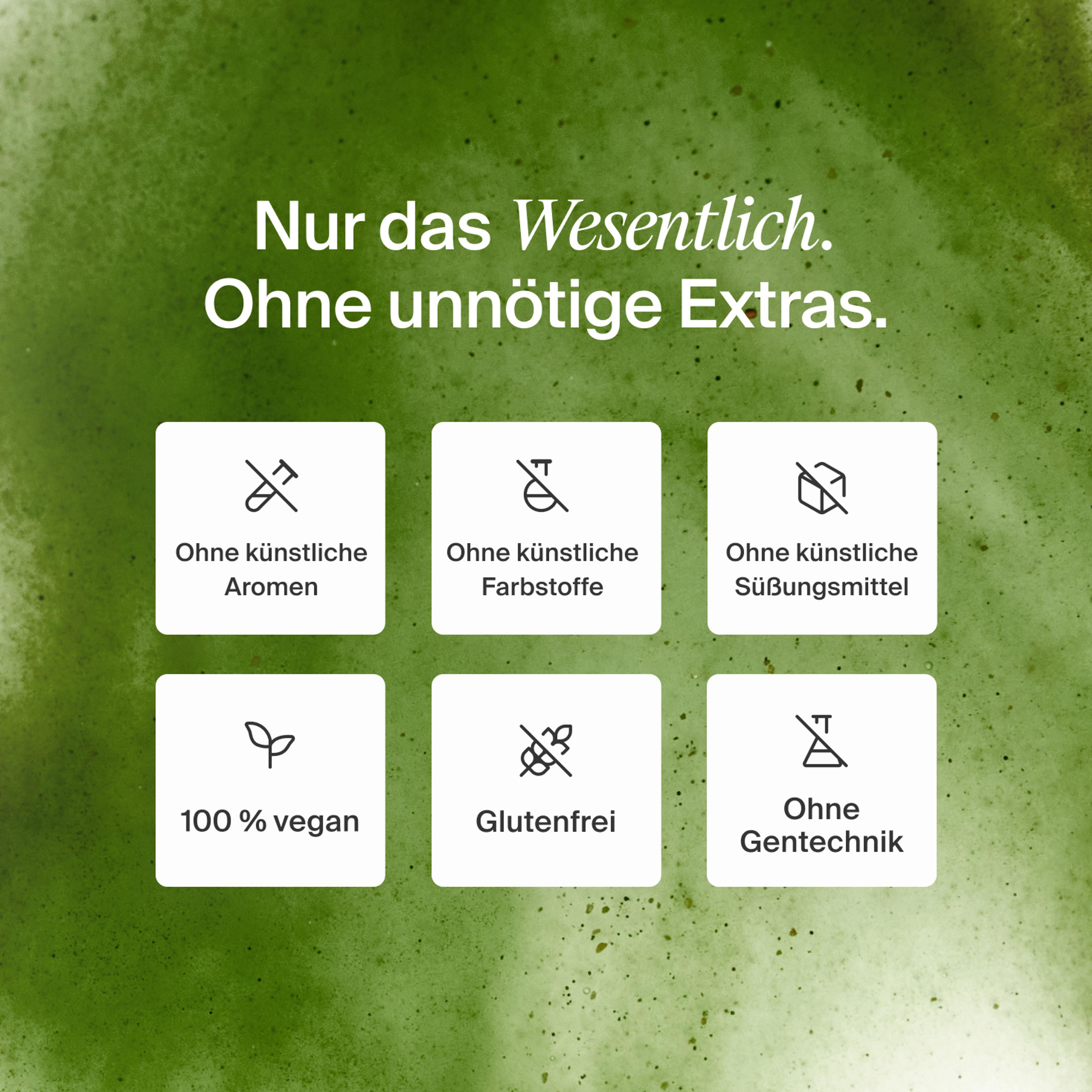 Nahaufnahme einer grünen Huel Daily Greens Flasche mit dem Logo.