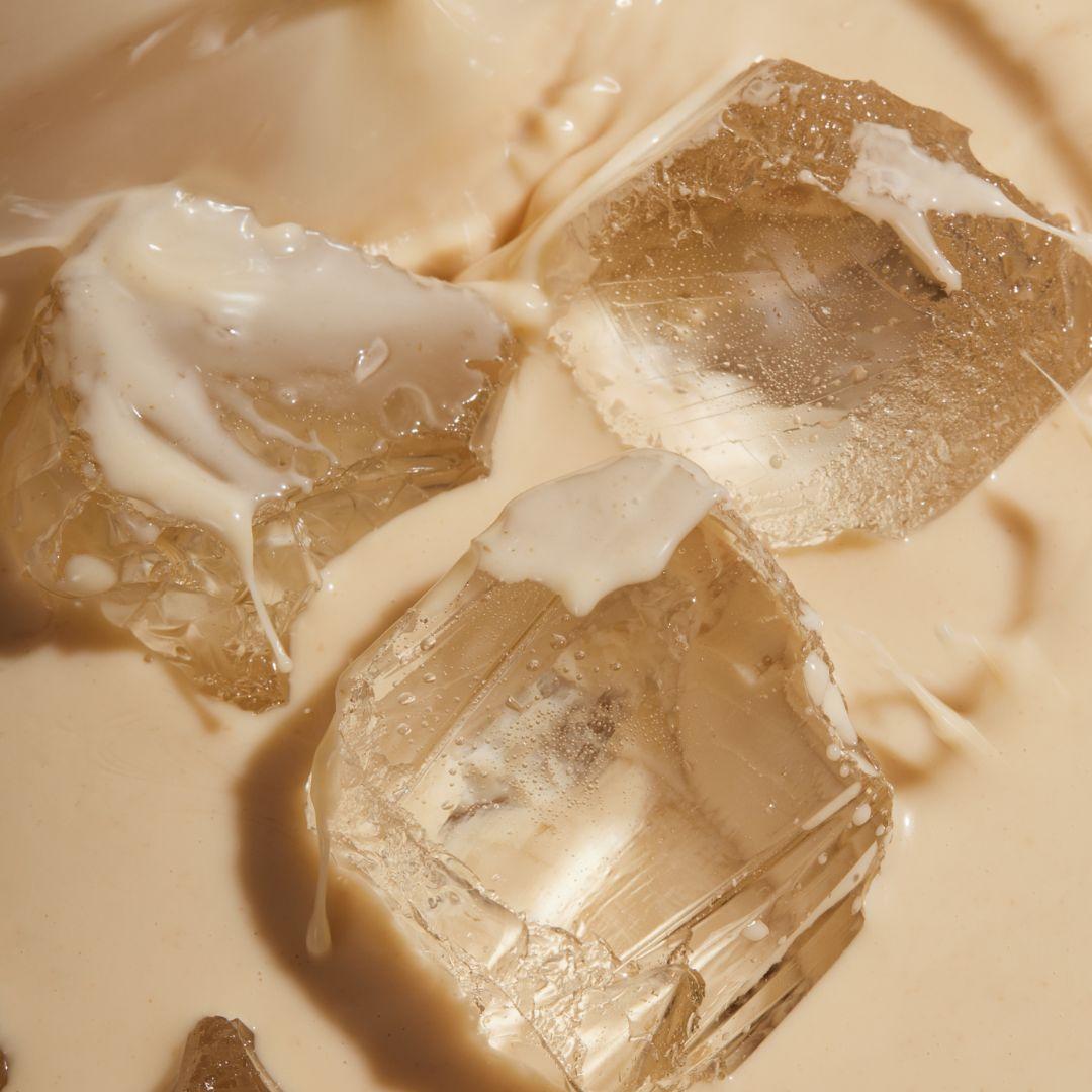 Huel Vanilla RTD with ice cubes in a glass