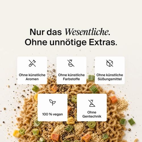Dried vegetables, herbs and noodles mixed on a neutral colour background