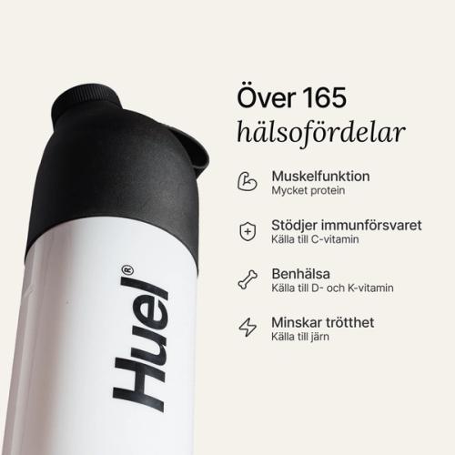 A black and white Huel shaker on a neutral colour background with health benefits in text beside it