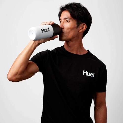 Close-up image on a corner of a Black Huel t-shirt