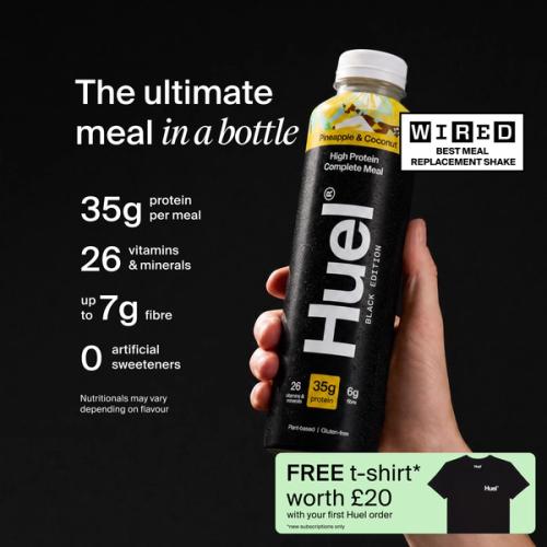 a hand holding a Bottle of Huel RTD with key benefits written next to it