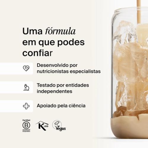 A glass of ice being filled by huel complete protein liquid