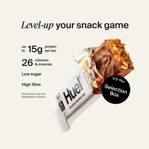 Alt: Huel Complete Nutrition Bar with a cut-open bar, alongside text highlighting up to 15g protein, 26 vitamins and minerals, low sugar, and high fibre.