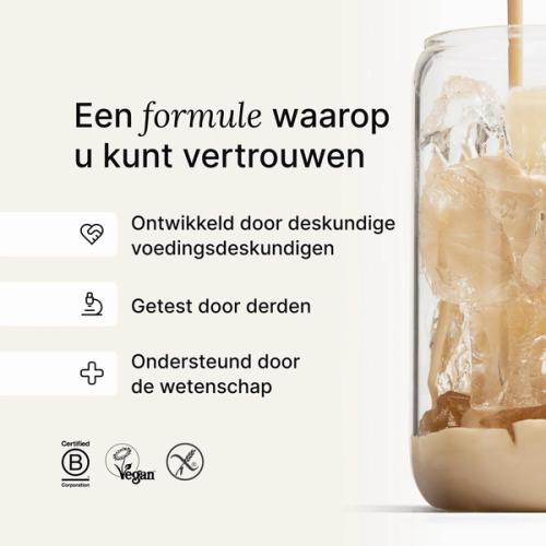 A glass of ice being filled by huel complete protein liquid