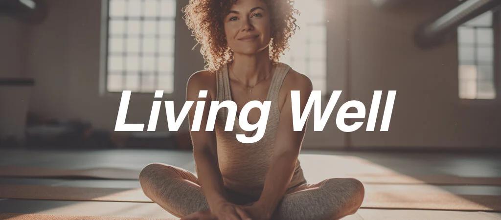 Woman sat down doing yoga in a sun lit room