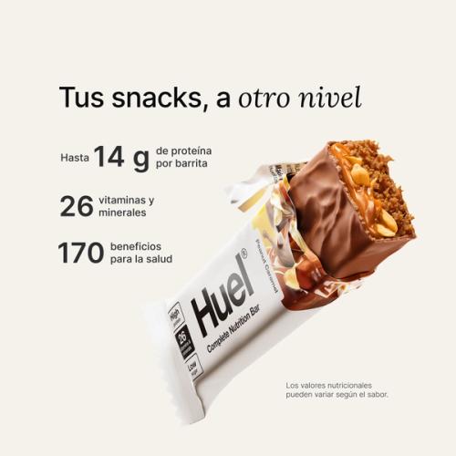 A Huel Complete Nutrition bar with a peanut and caramel filling, set against a beige-colour background