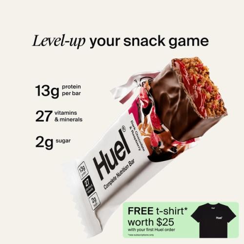 A houeal.complete Nutrition bar with a peanut and caramel filling, set against a beige-colour background
