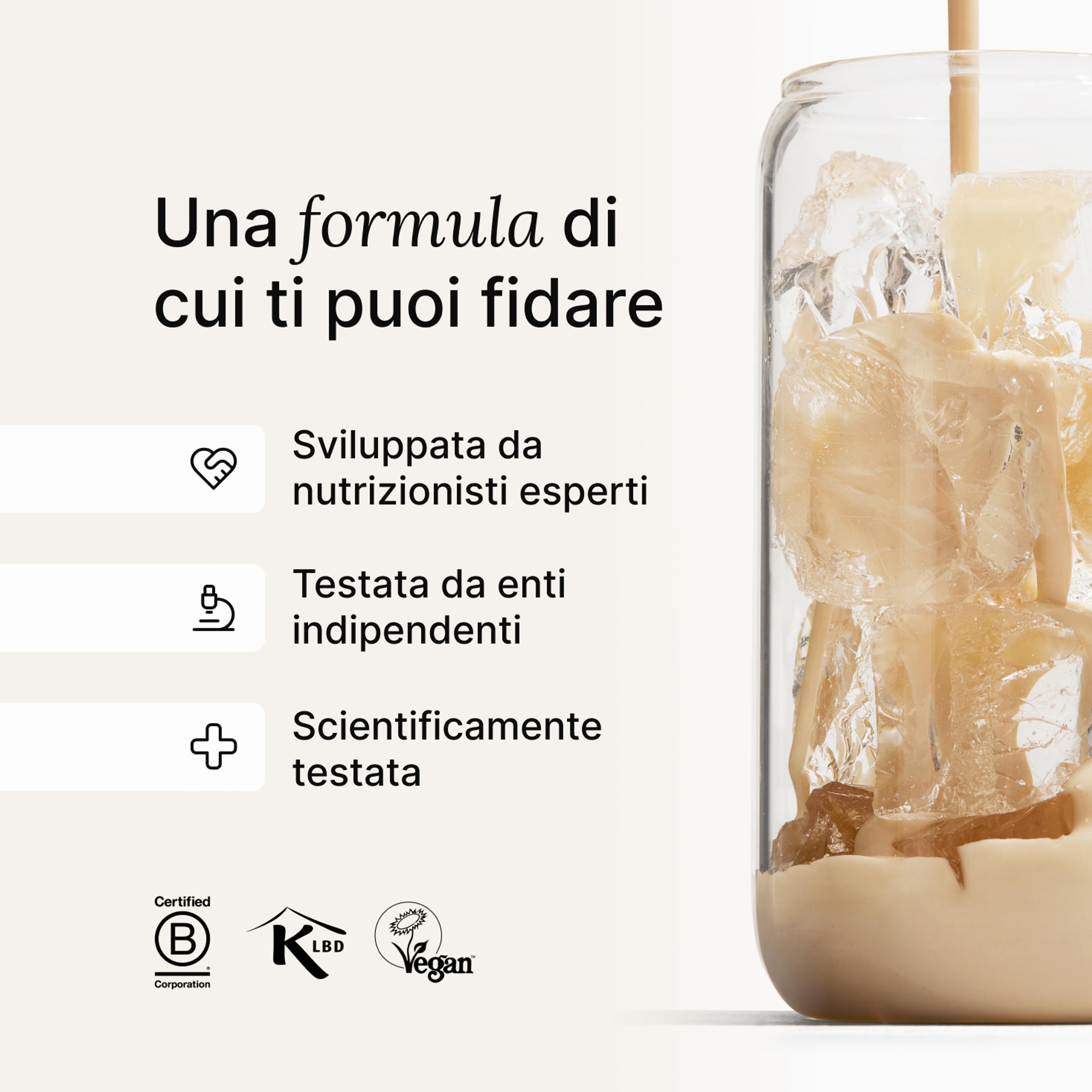 A glass of ice being filled by huel complete protein liquid