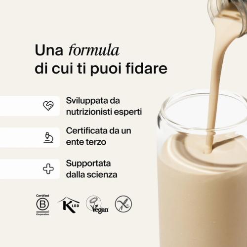 Huel RTD protein drink being poured into a glass filled with ice