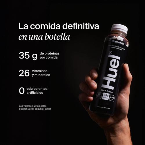 a hand holding a Bottle of Huel RTD with key benefits written next to it