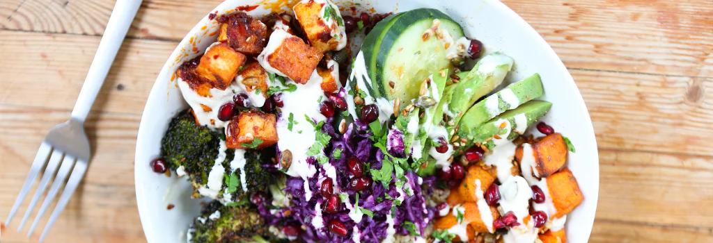 Vegan summer buddha bowl with cucumber, avocado, quinoa and more