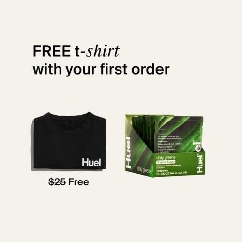 Daily Greens Travel Packs, a black Huel t-shirt, set against a beige background.