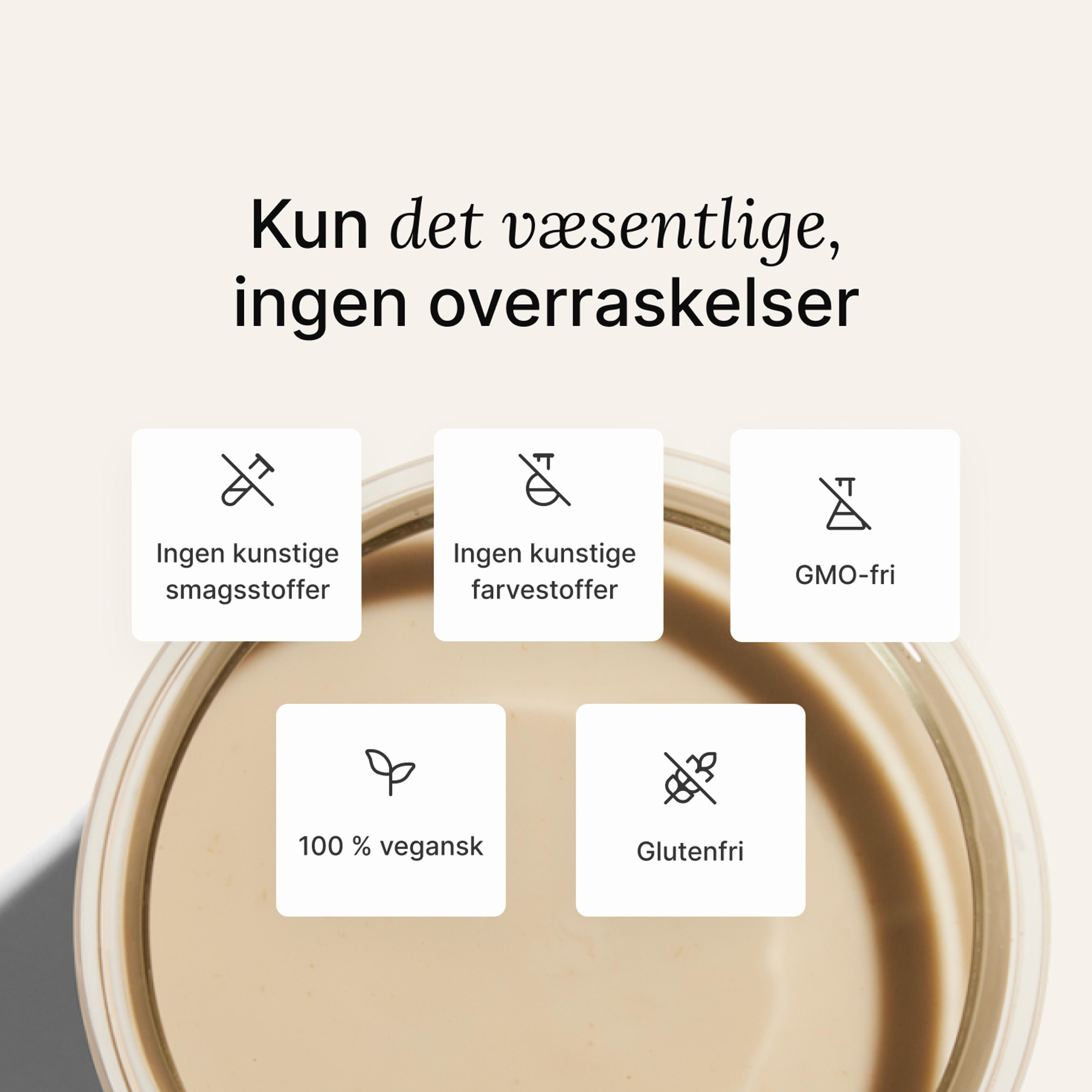 A glass of Huel complete protein shake on a neutral colour background