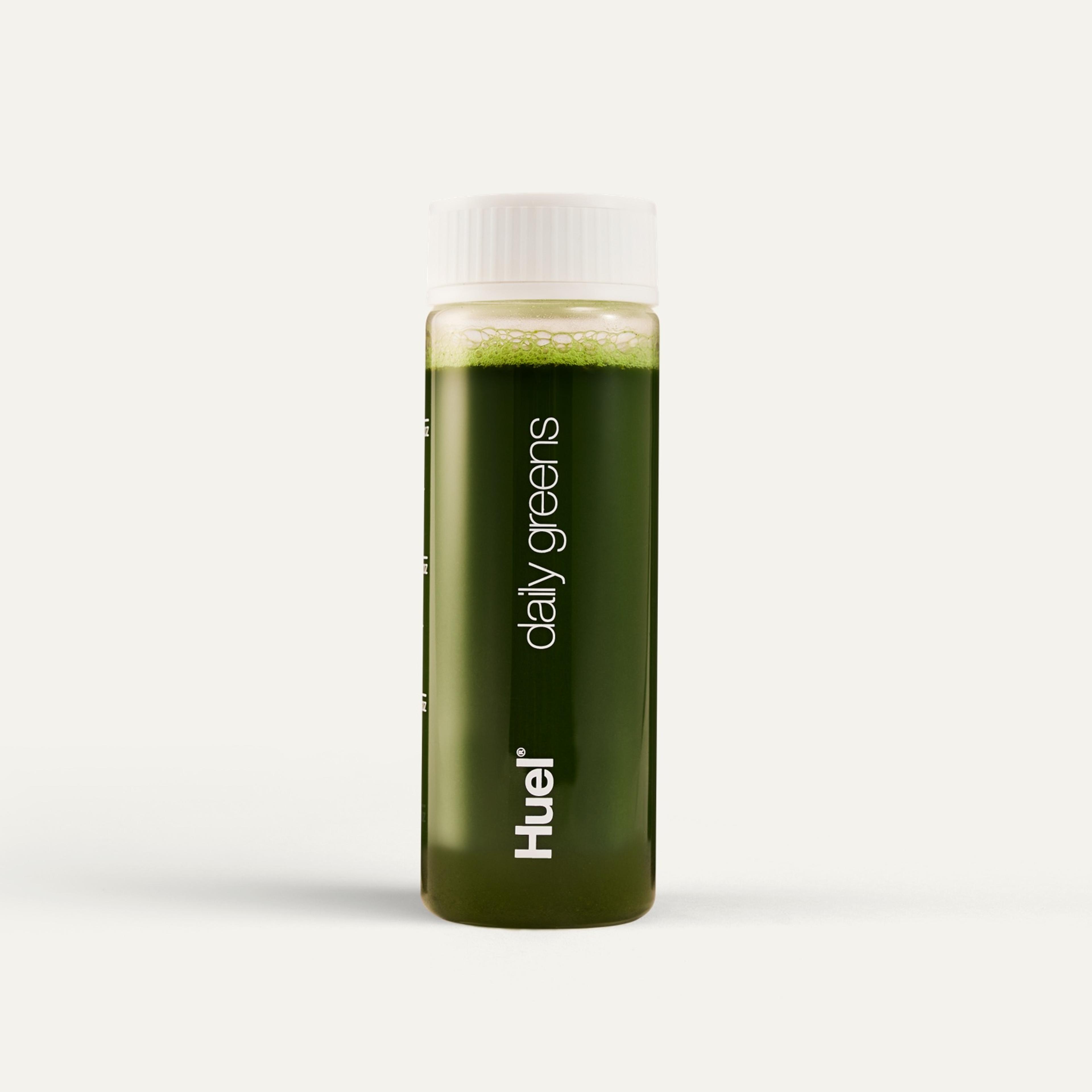 Clear Huel Daily Greens bottle filled with greens powder liquid
